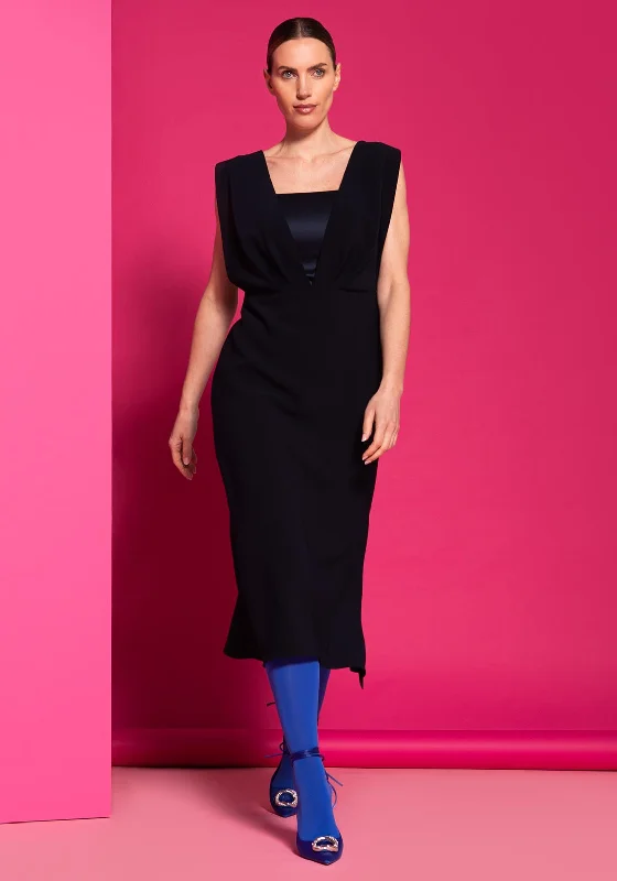 Halterneck dress – Dress with straps that tie around the neck, leaving the shoulders and back exposed.Halterneck dress – Dress with straps that tie around the neck, leaving the shoulders and back exposed.Caroline Kilkenny Liliana Dress, Navy