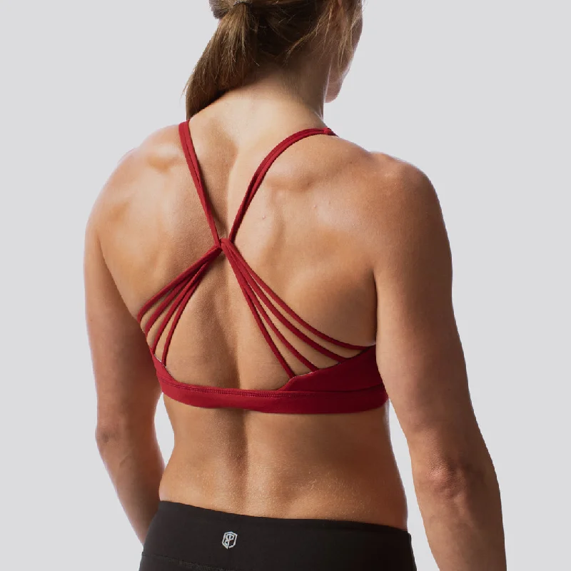 Compression sports bra – Sports bra that compresses the chest for a more secure fit and reduced bounce during high-impact activities.Compression sports bra – Sports bra that compresses the chest for a more secure fit and reduced bounce during high-impact activities.Vitality Sports Bra 2.0 (Wine)